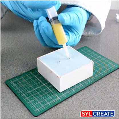 Monoject syringe used to dispense polyurethane casting resin into a silicone rubber mould