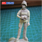 War correspondent figure converted to a photographer